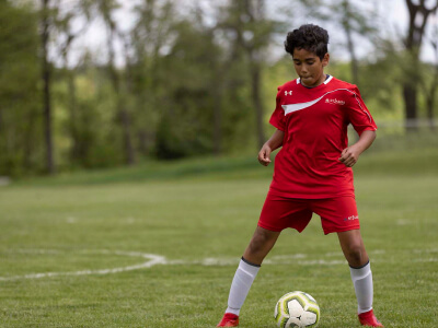 Student Playing Soccer